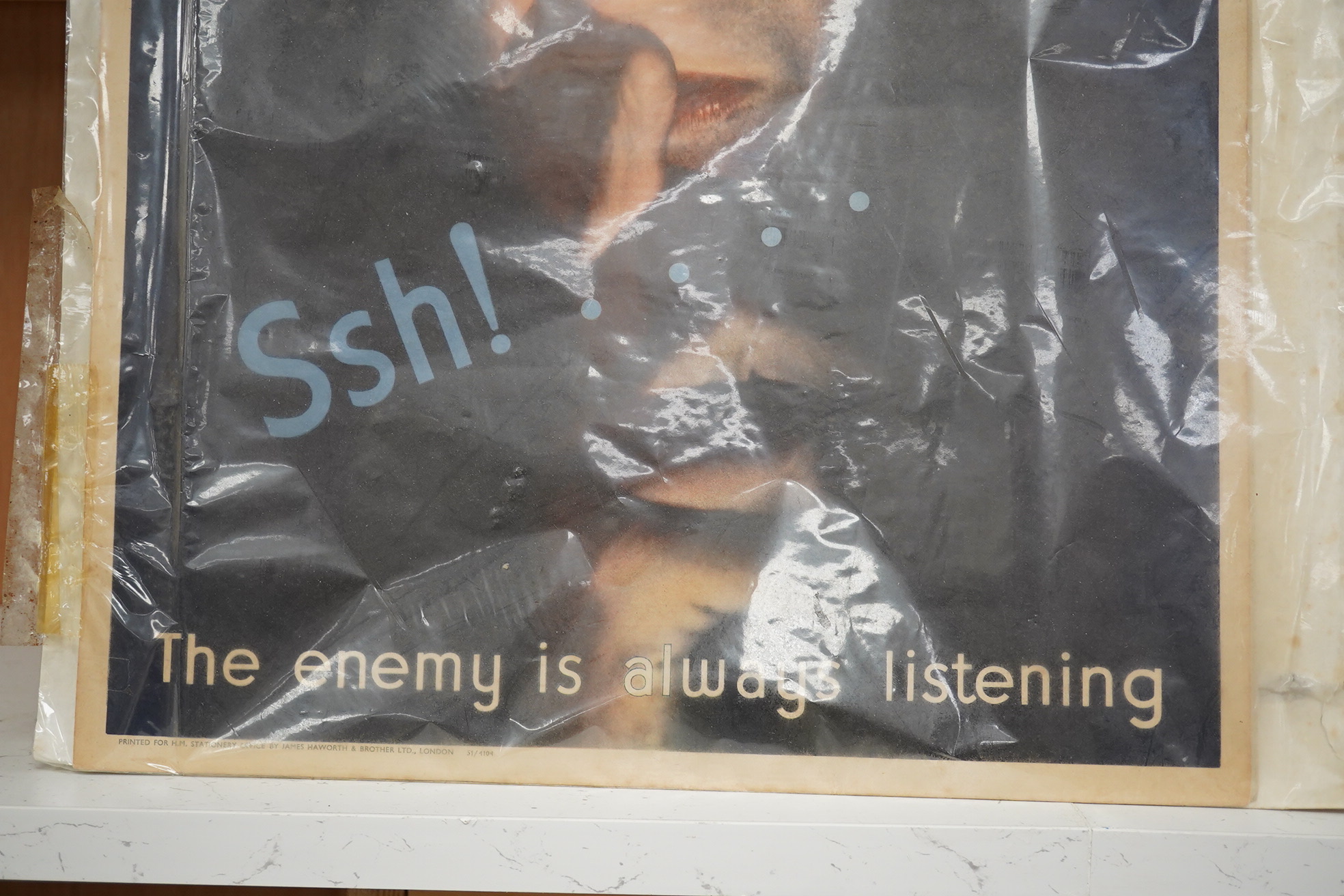 A Second World War British poster; ‘The enemy is always listening’, designed by Noke and printed for H.M. Stationery Office by James Haworth and Brother Ltd., London, 49 x 37cm. Condition - good